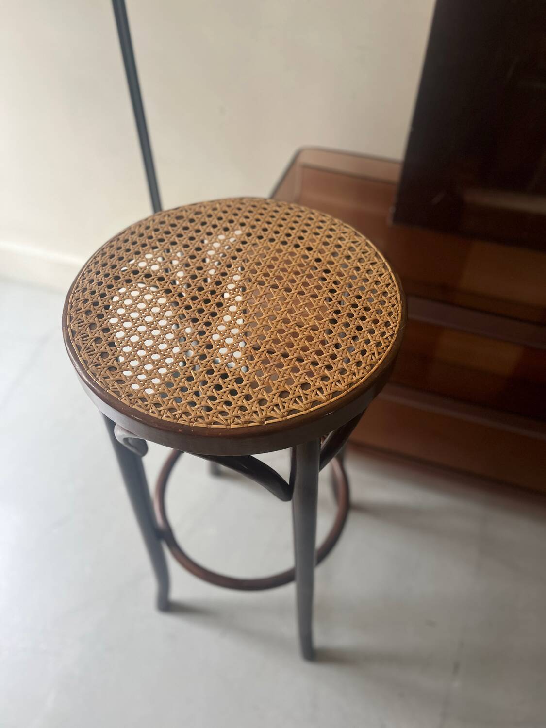 High bistro stool in turned wood and new cane, 1950
