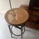 High bistro stool in turned wood and new cane, 1950