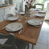 Farmhouse table with pearl gray base and raw wood top.