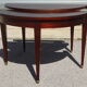 Half-moon console table, extendable in Empire style.