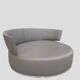 Circular rotating leather canapé with 6 cushions.