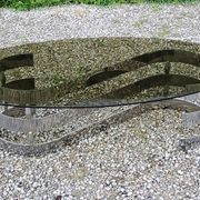 Oval coffee table of the 70s chromed metal base in s smoked glass top