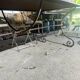Old wrought iron table and its armchairs and chairs for outdoor use.