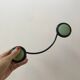 Design coat hook in sage green and black metal from the 70s