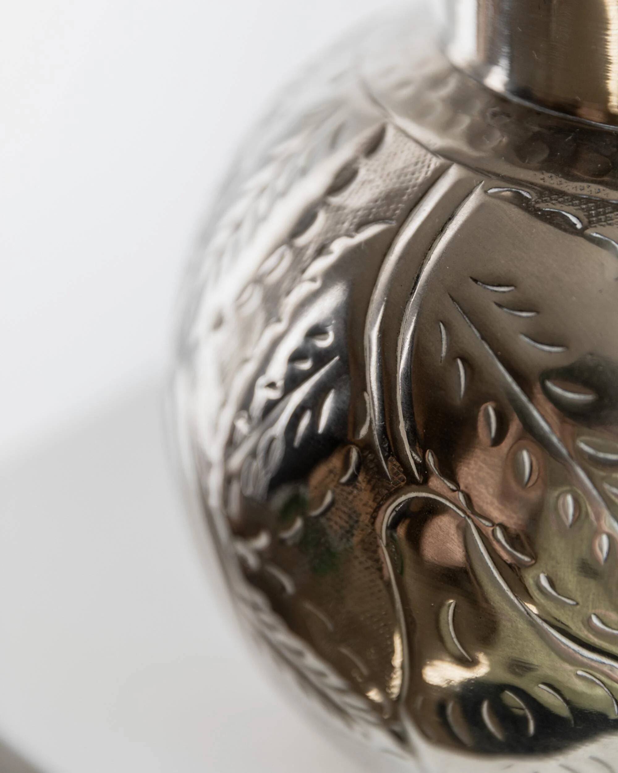 Vintage Italian vase in nickel-plated brass from the 1960s, hand-hammered relief of fruits and leaves.
