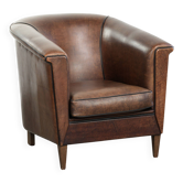 Art Deco style sheepskin club armchair finished with black piping