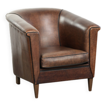 Art Deco style sheepskin club armchair finished with black piping