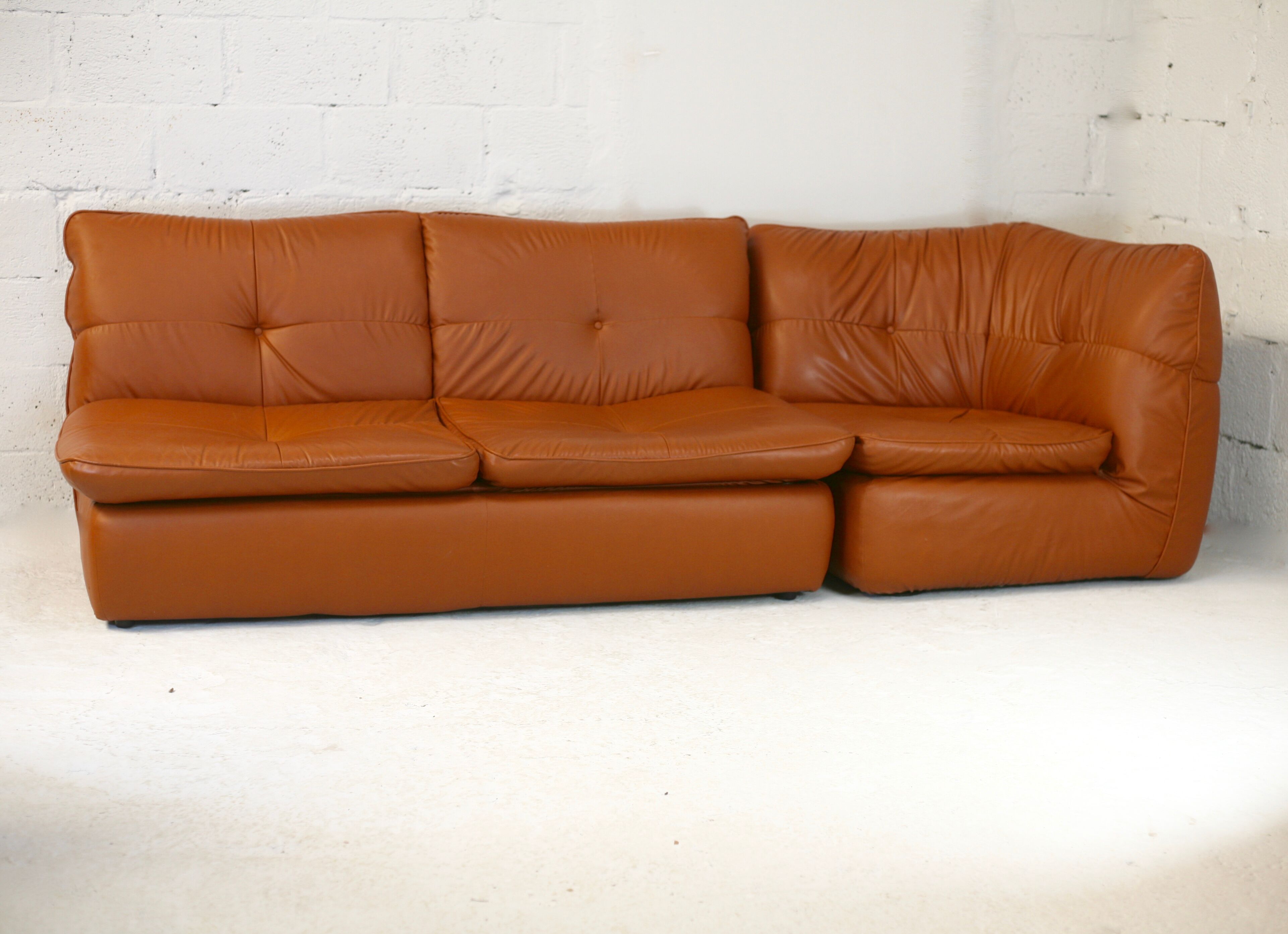 Imitation leather sofa "caramel". Convertible. France, circa 1990
