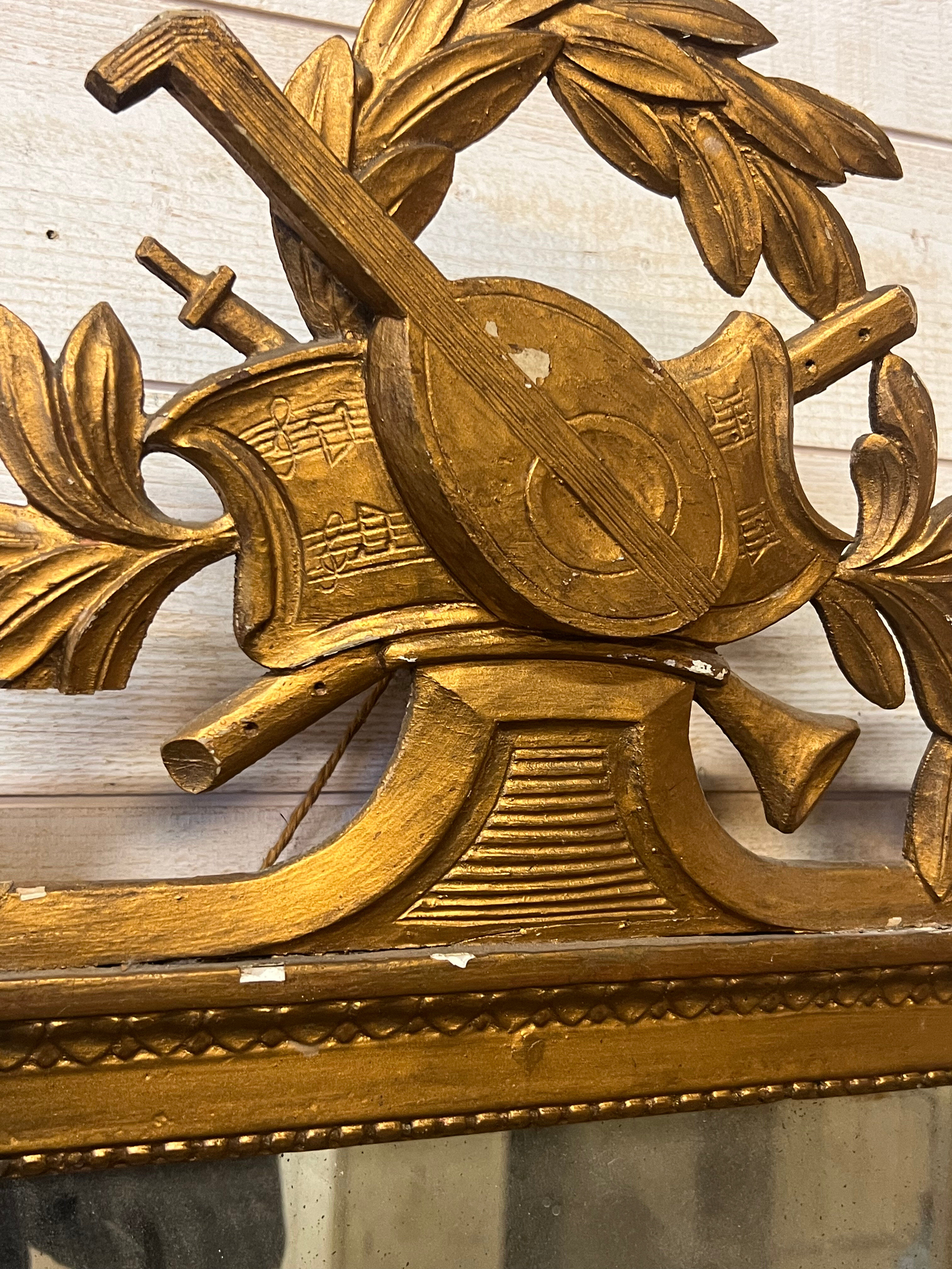 Neoclassical mirror in gilded wood