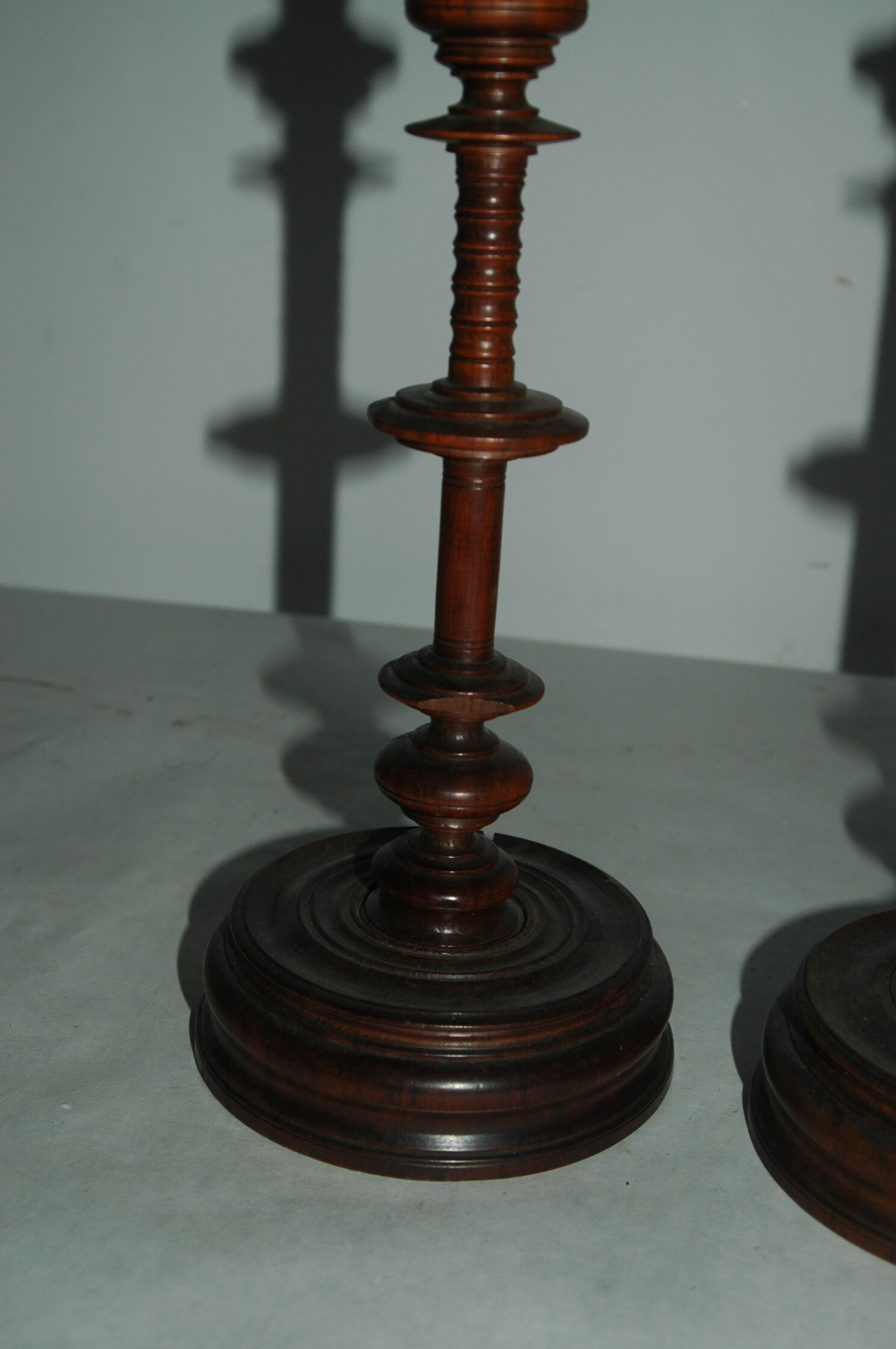 Pair of mahogany turned wood candlesticks