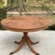 Extendable round dining table with central leg renovated in raw wood 205cm
