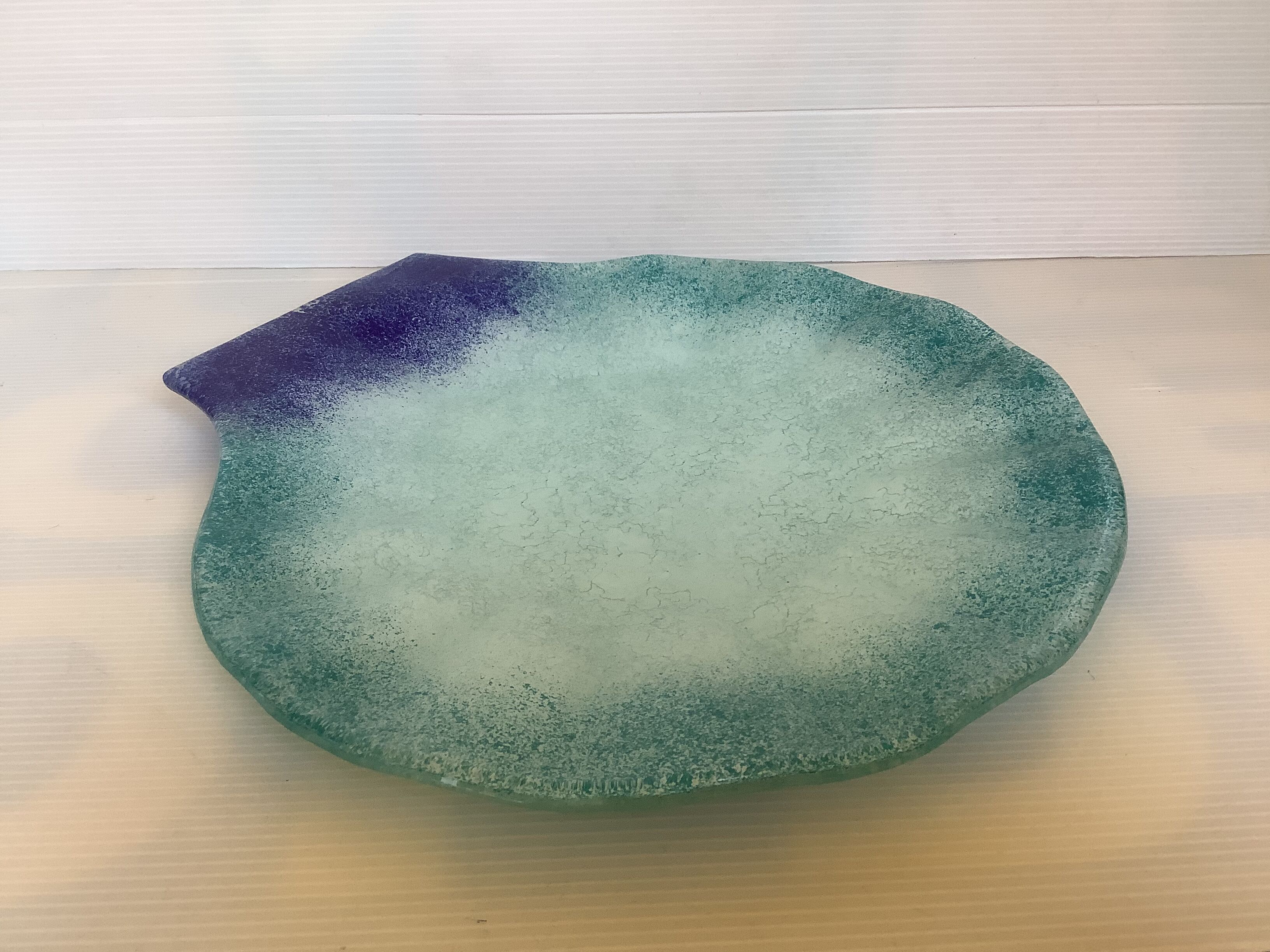 Blue glass paste pocket emptier