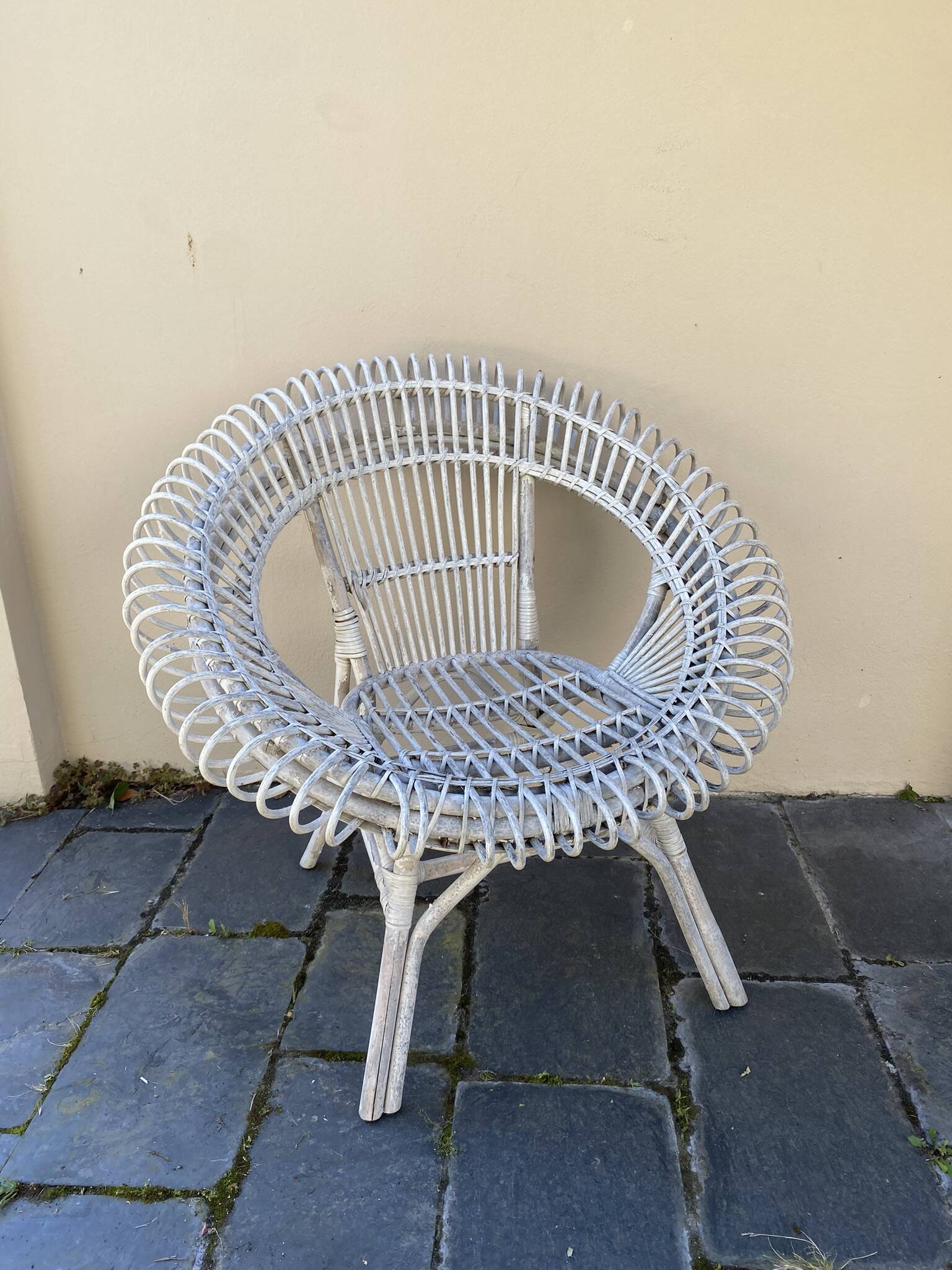 Vintage white rattan armchair