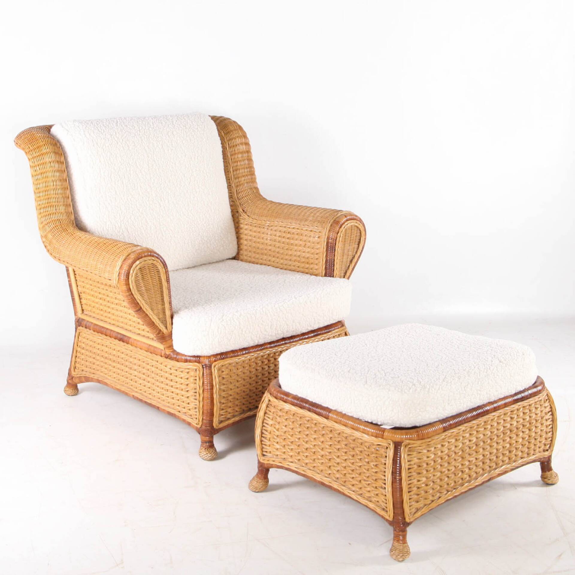 Large wicker armchair and its ottoman
