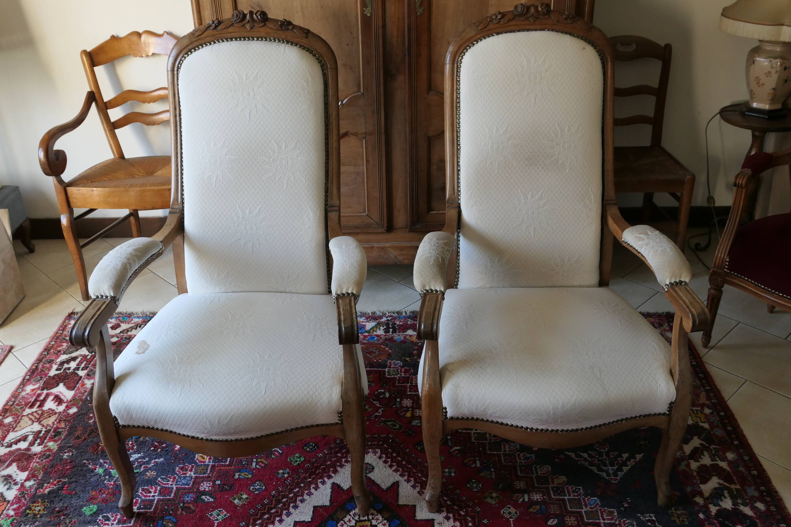 Pair of antique Voltaire armchairs, carved back