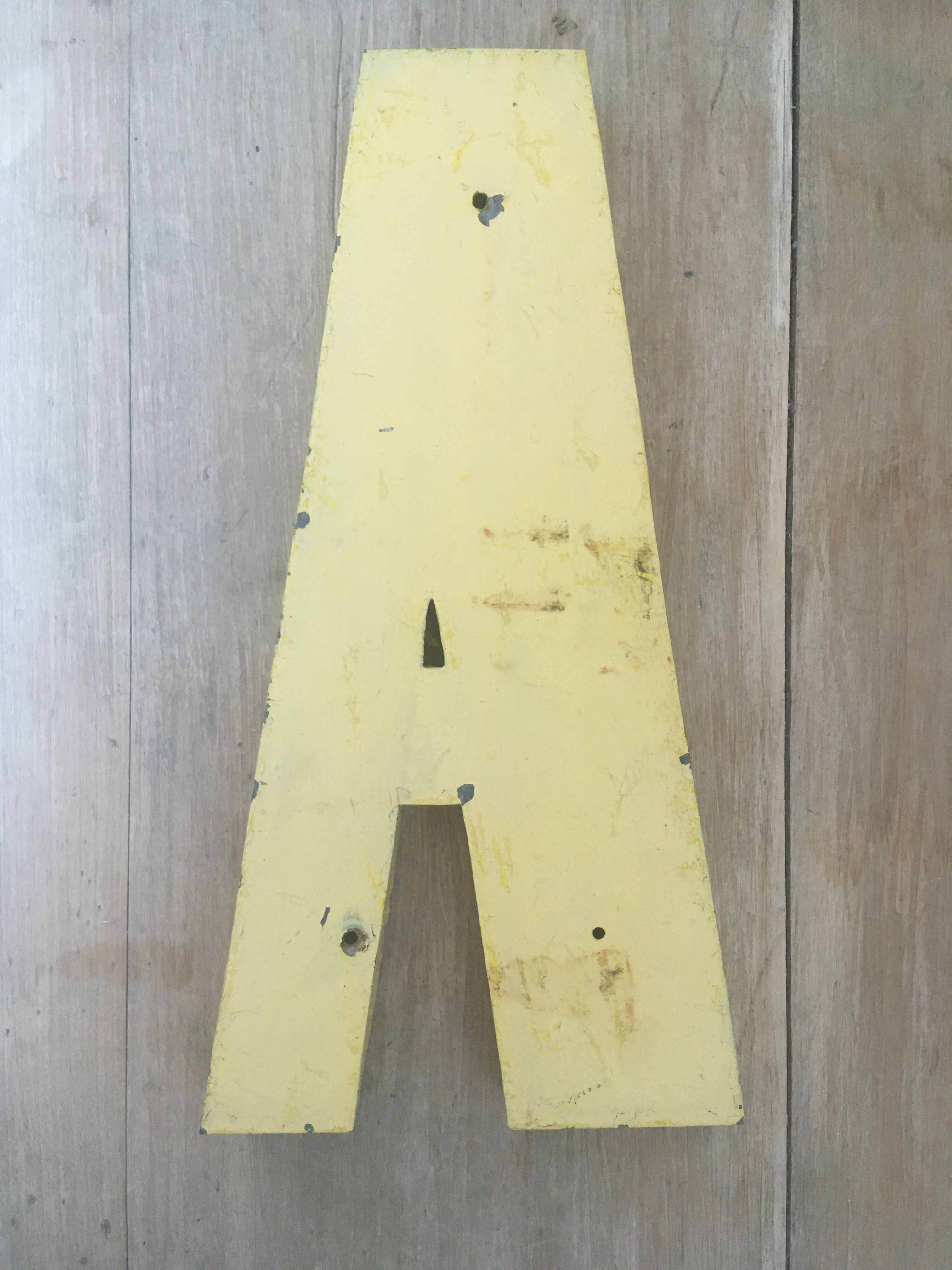 Vintage yellow sign letter A