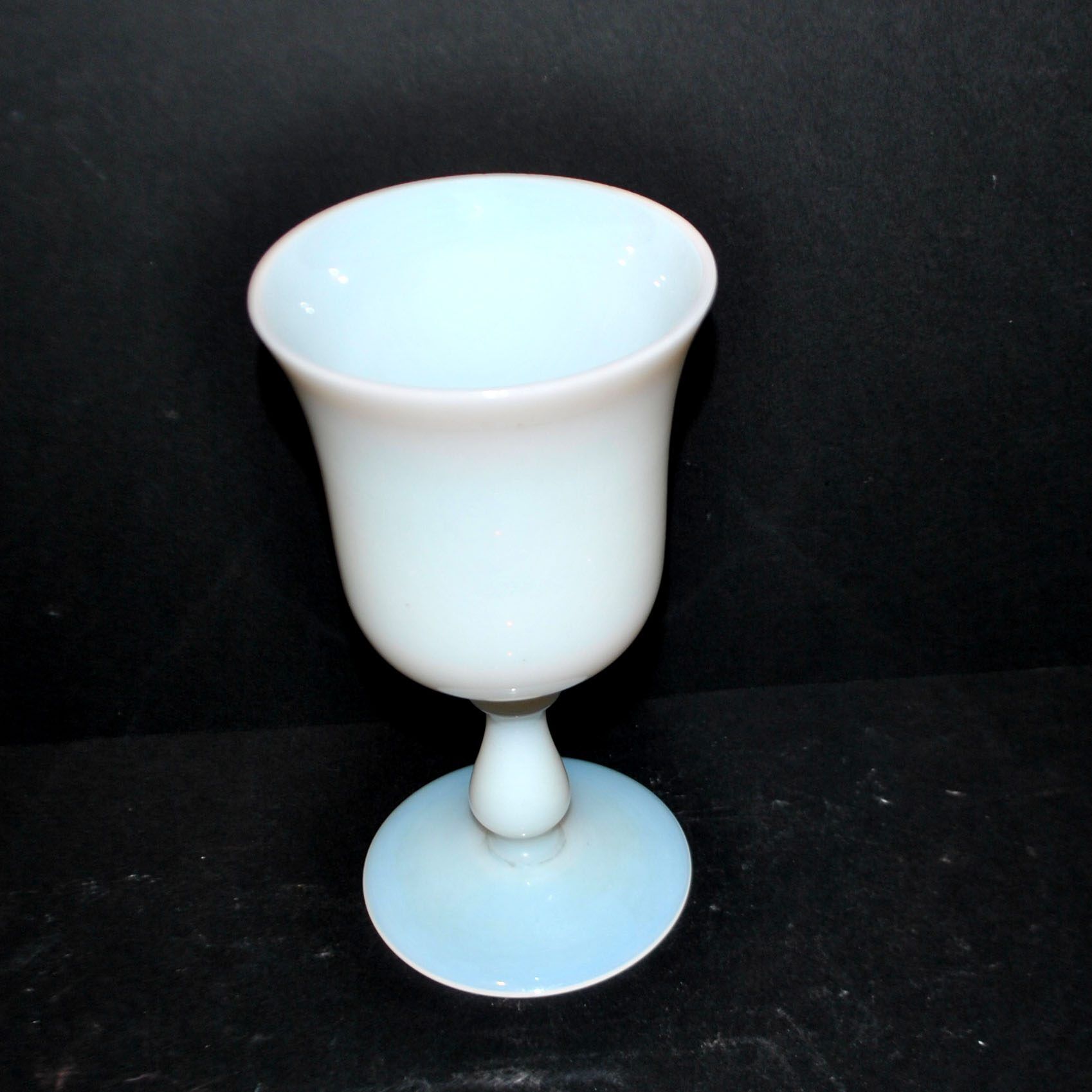 Ancient opaline white glass goblet with a soap bubble effect.
