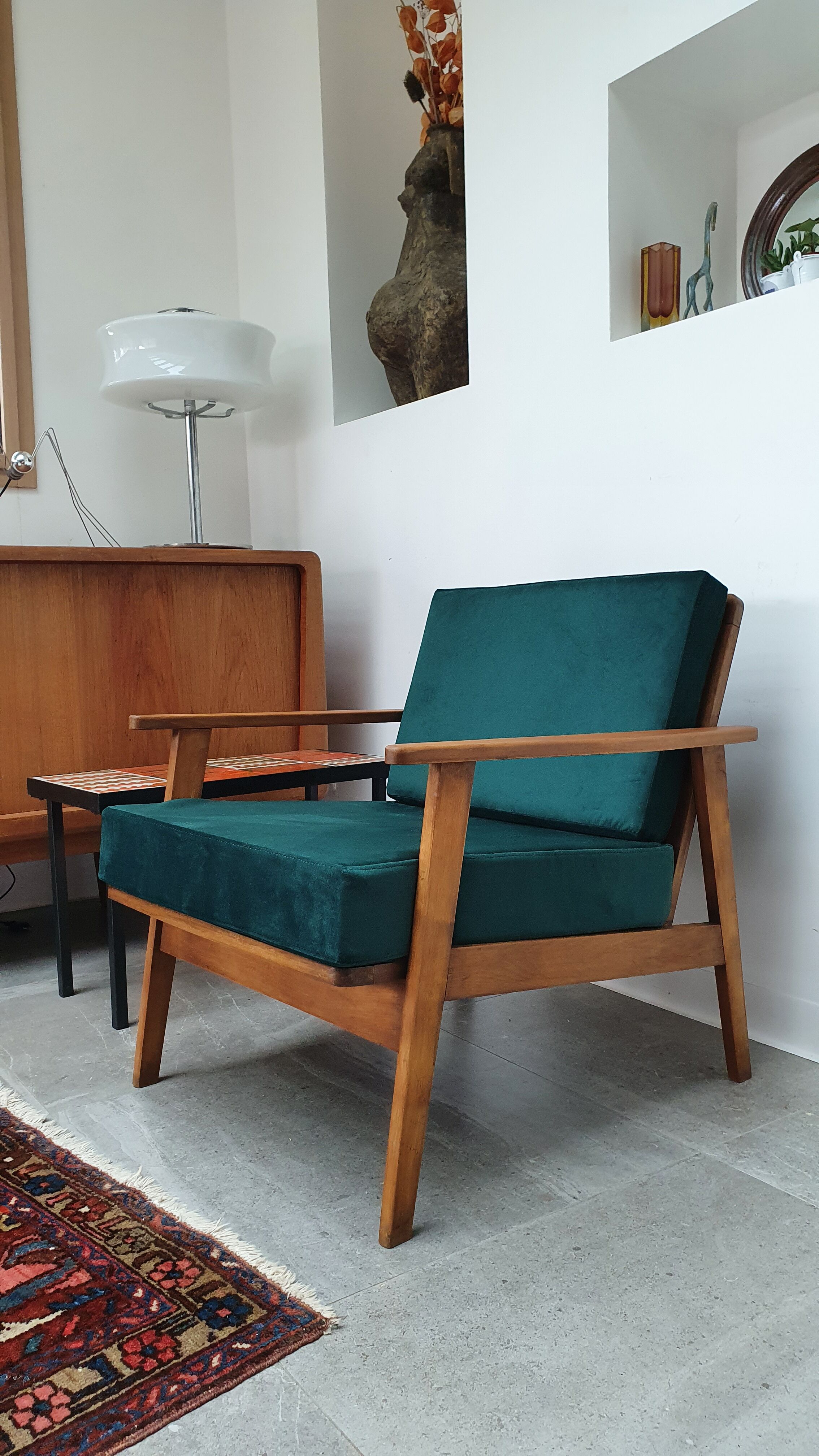 Scandinavian style armchair in forest green velvet