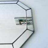 Old octagonal beveled mirror with parcloses