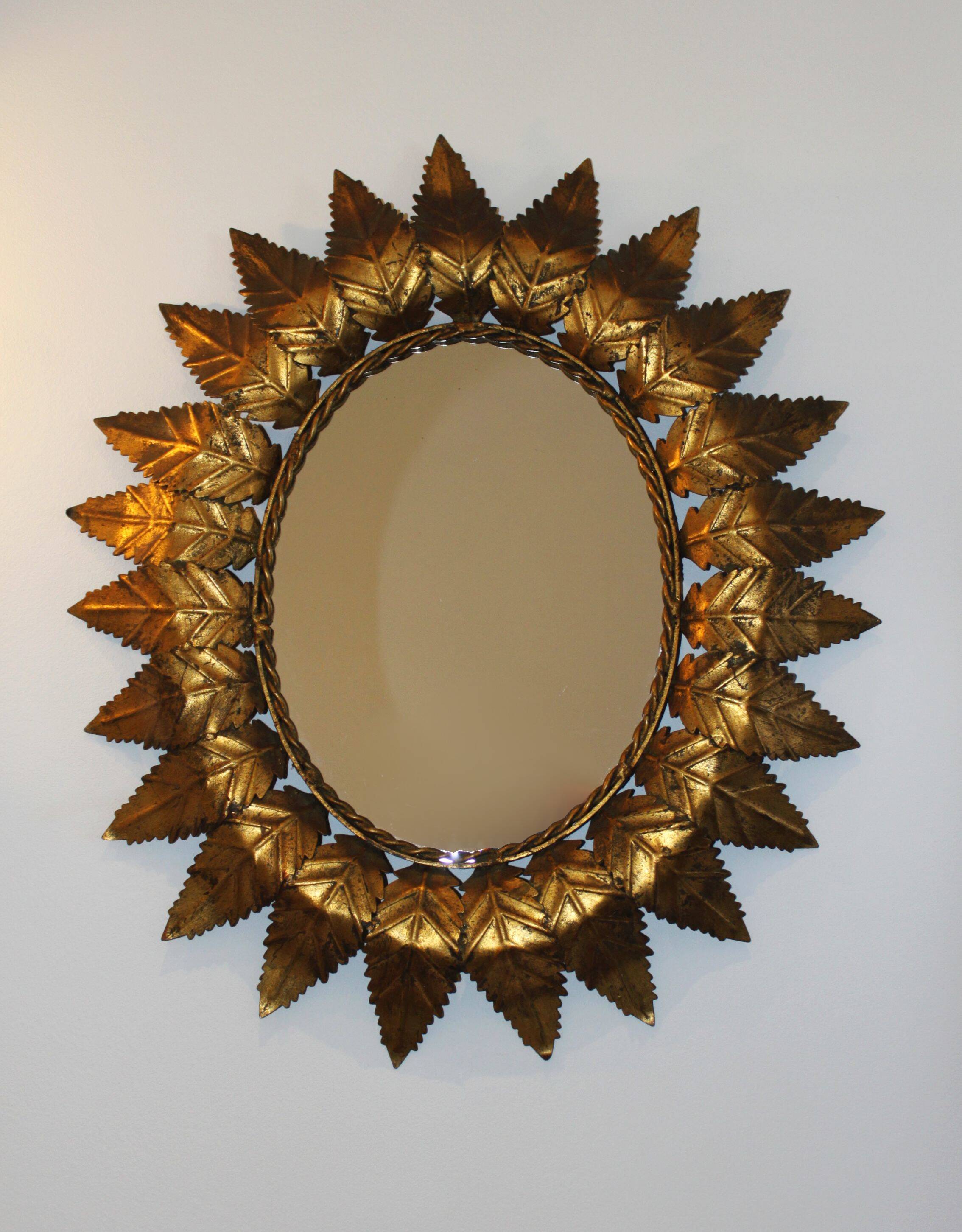 Oval sun mirror, 61x52cm.