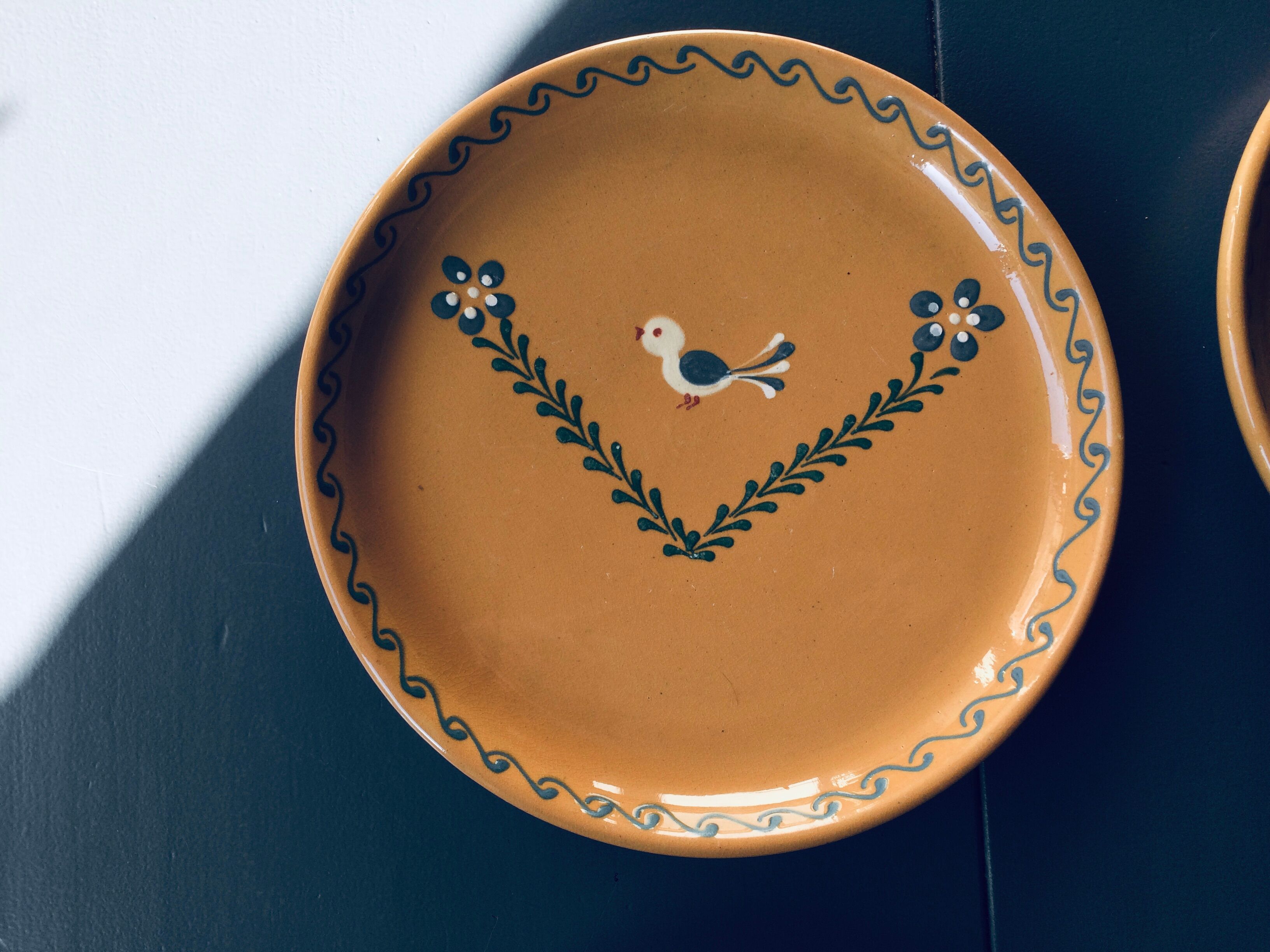 The six Piaf plates in painted terracotta