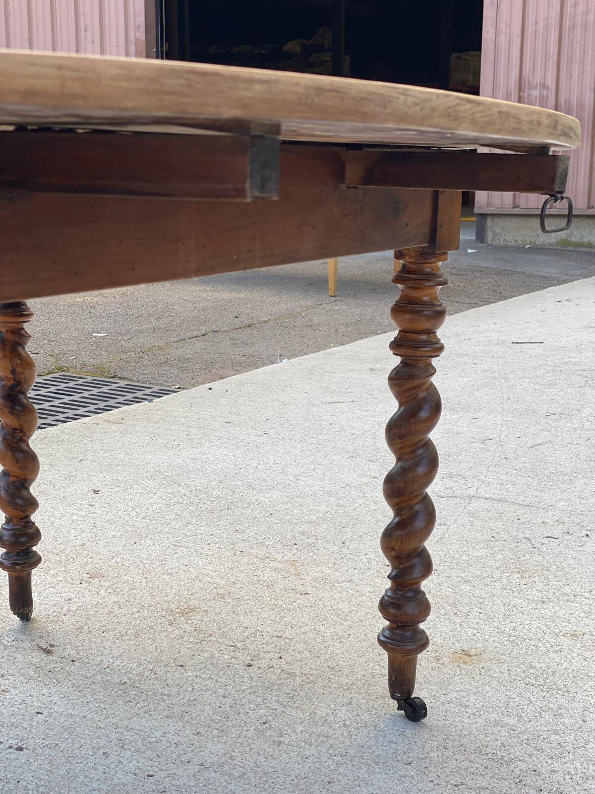Louis Philippe oval table with shutters, 19th century, solid oak wood, twisted leg