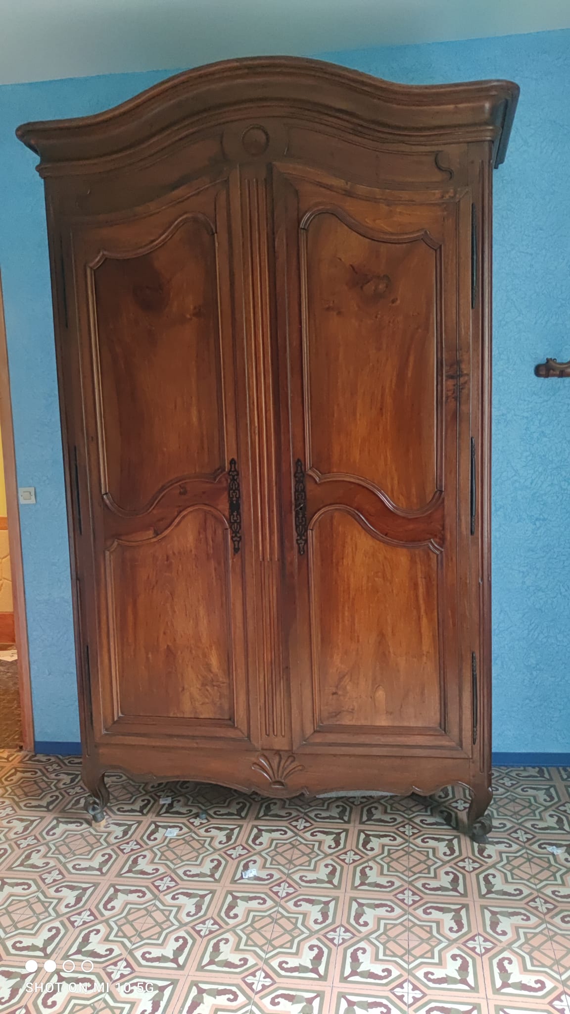 Large Louis XV style gendarme's hat-shaped wardrobe