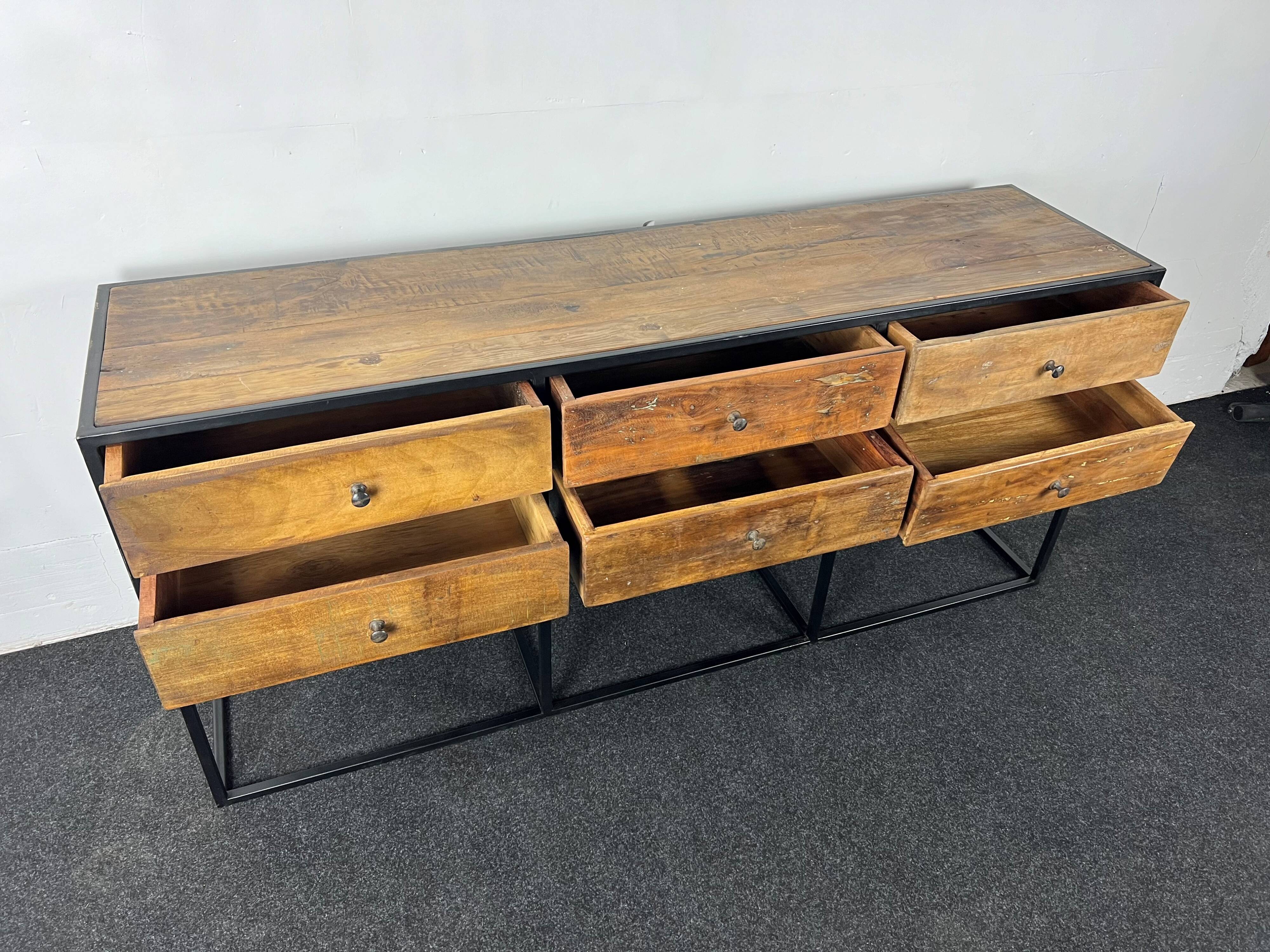 Antique wooden console with black metal base and 6 drawers