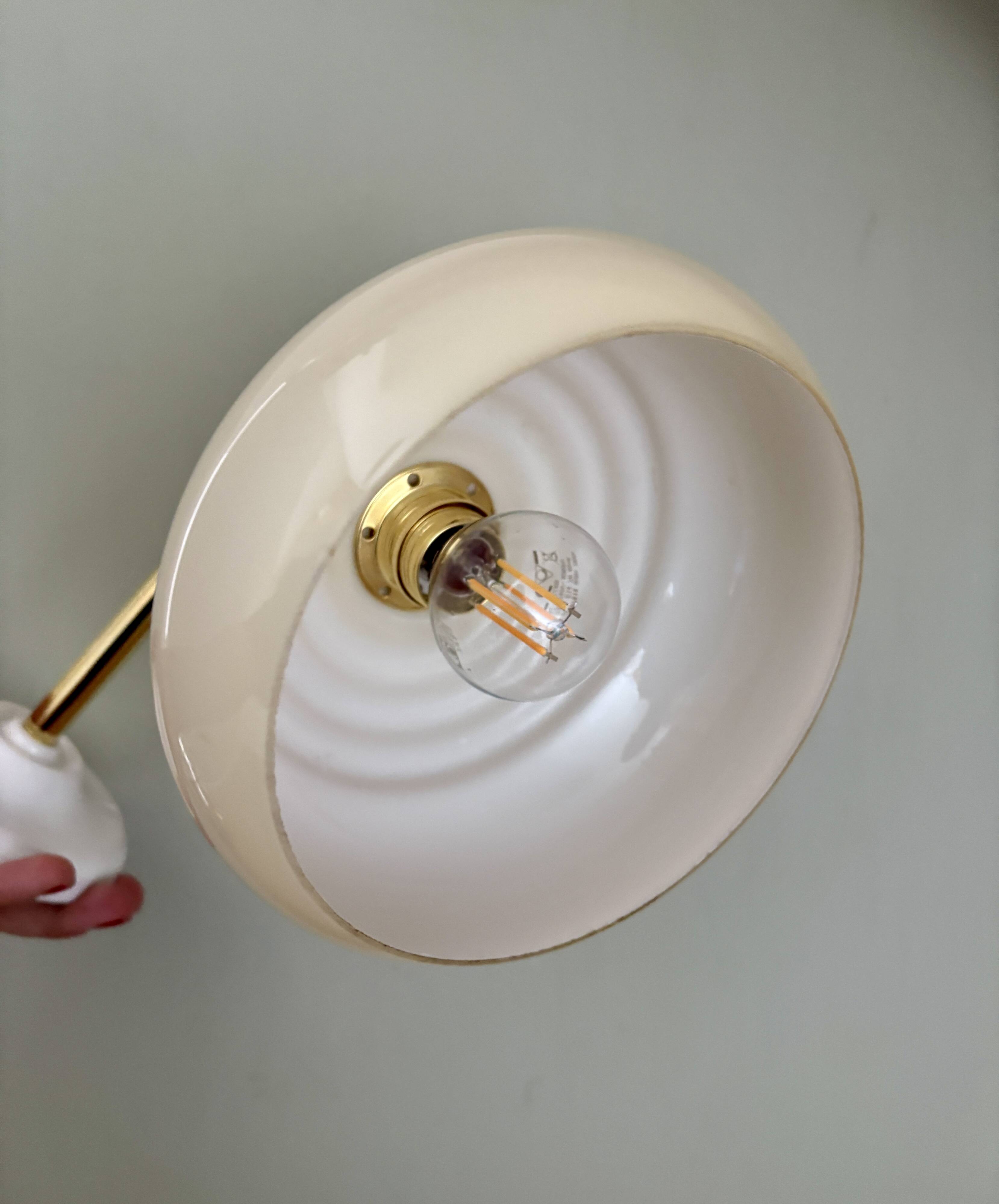 Vintage angled wall lamp with pale yellow opaline shade