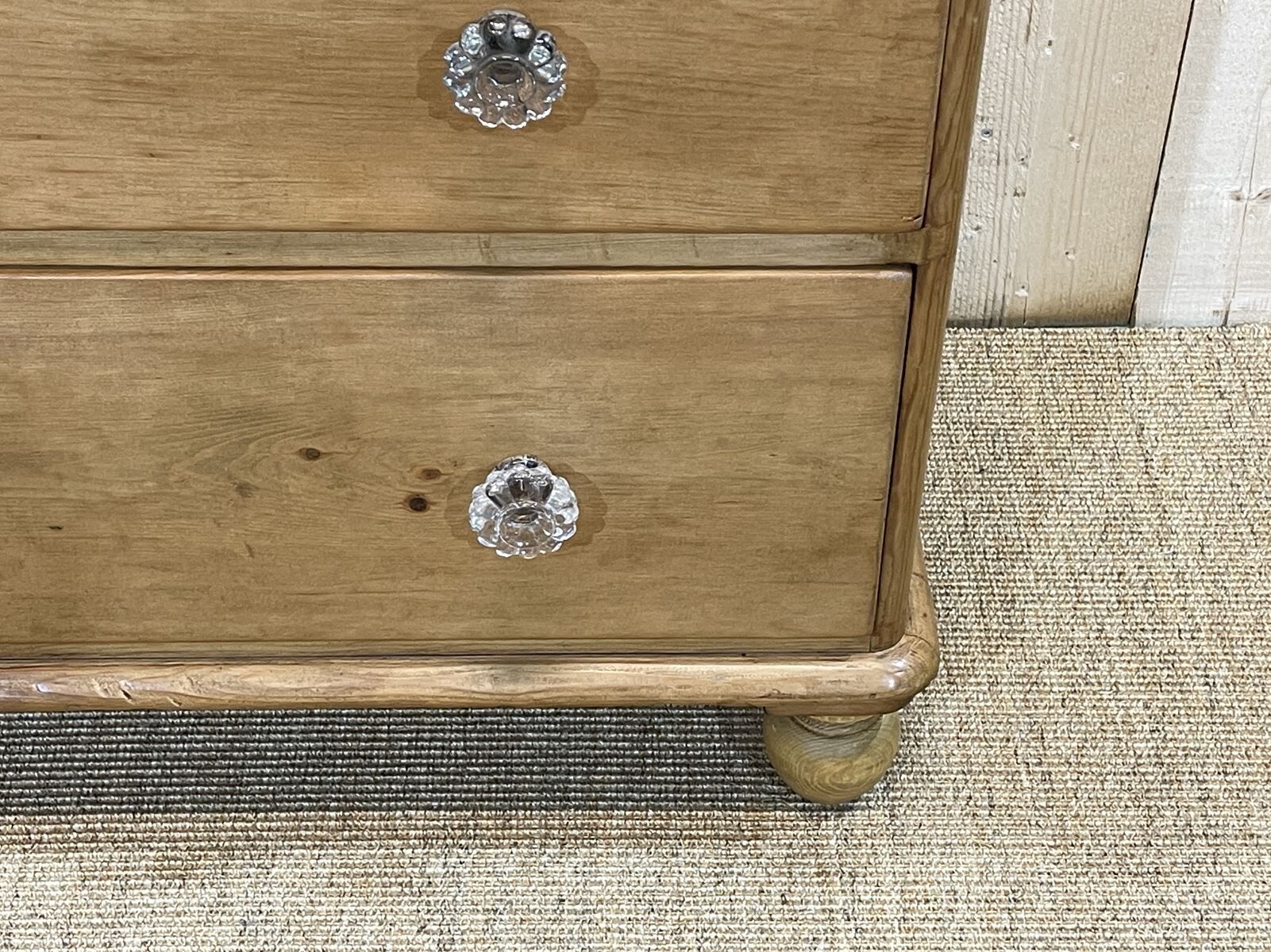 English chest of drawers in nineteenth century fir with its glass buttons