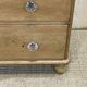 English chest of drawers in nineteenth century fir with its glass buttons