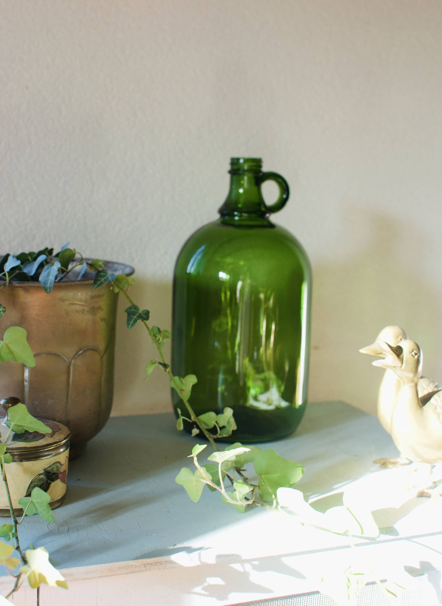 Bonbonne vintage en verre vert