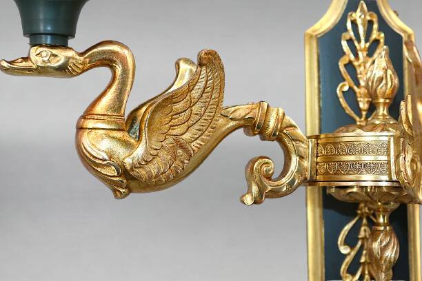 Pair of gold bronze wall lights in Empire style with three lights "Lucien Gau"
