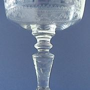Suite of six champagne glasses on foot in engraved colorless crystal