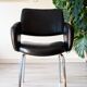 Modernist armchair from the 50s-60s, chrome and faux leather.