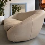 Rounded off-white leather sofa