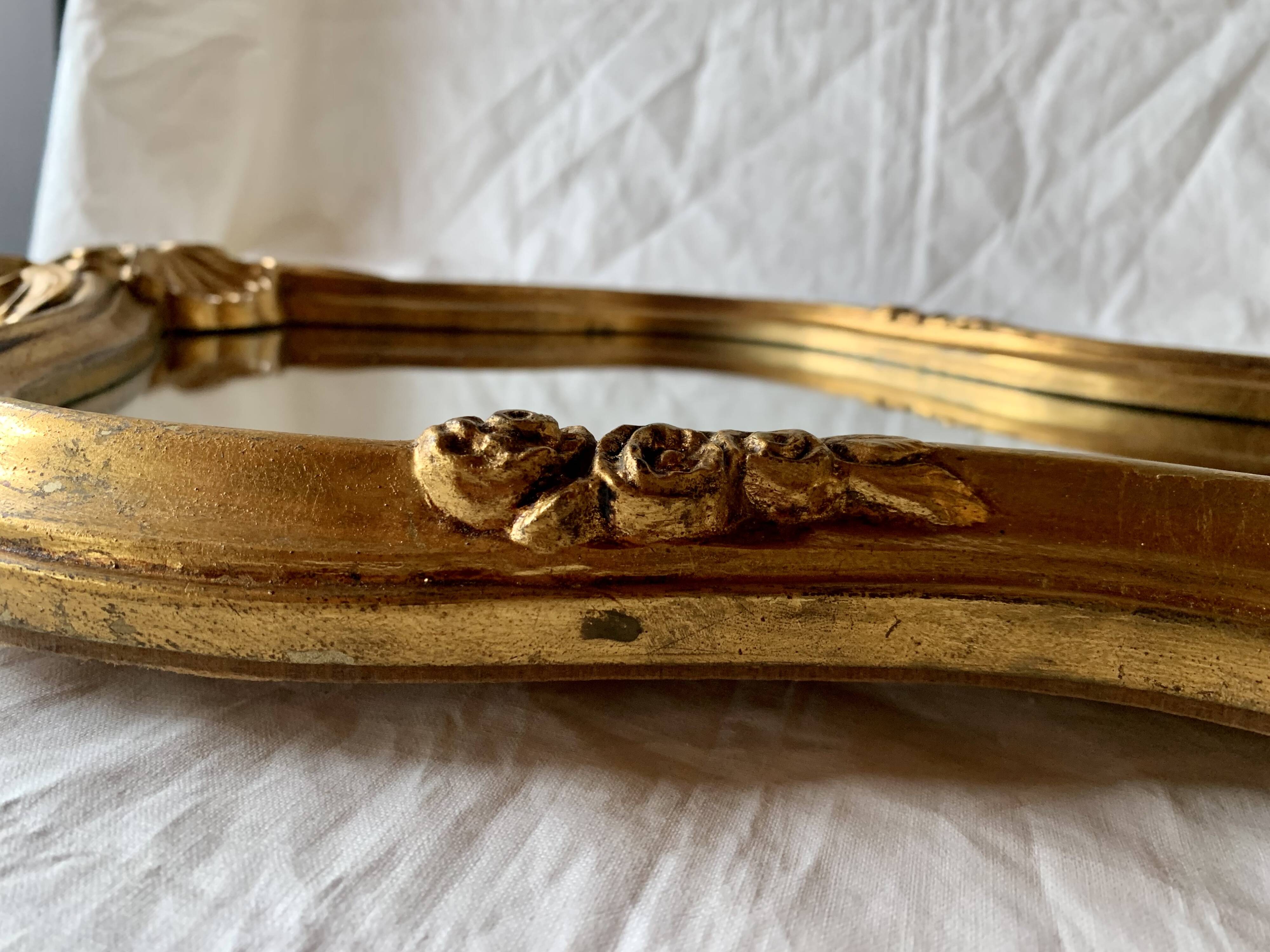 Large rococo mirror in gilded wood