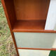Vintage 1960s display shelf with sliding glass doors.