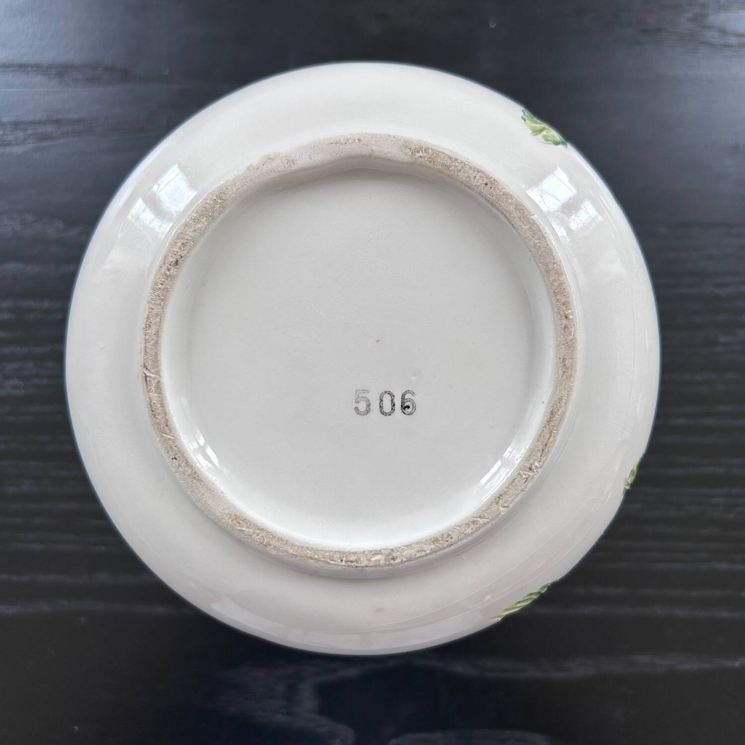 Flower pot with floral decoration in slip