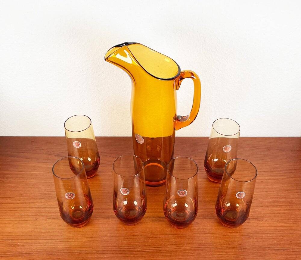 Amber glass carafe from the mid-century German Jagdhaus series and drinking glasses by Wilhelm Braun-Feldweg for Hirschberg, 1960s, set of 7.