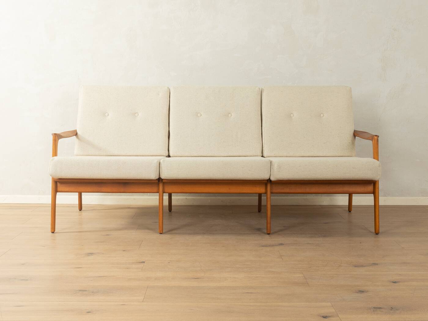 Elegant mid-century sofa from the 1960s with cream-white upholstery