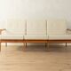 Elegant mid-century sofa from the 1960s with cream-white upholstery