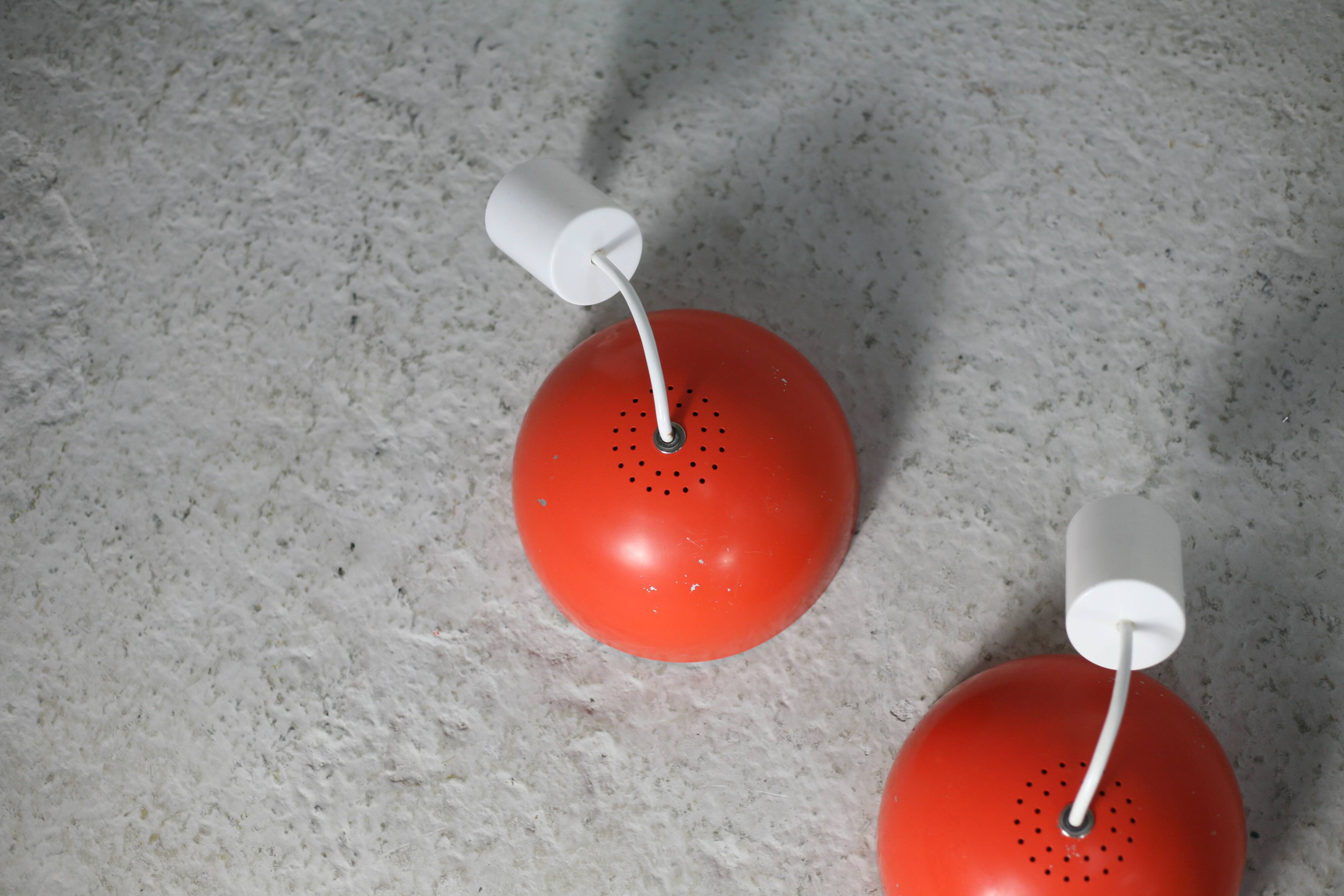 Set of 4 "spring" hanging lamps, orange steel, France, circa 1970