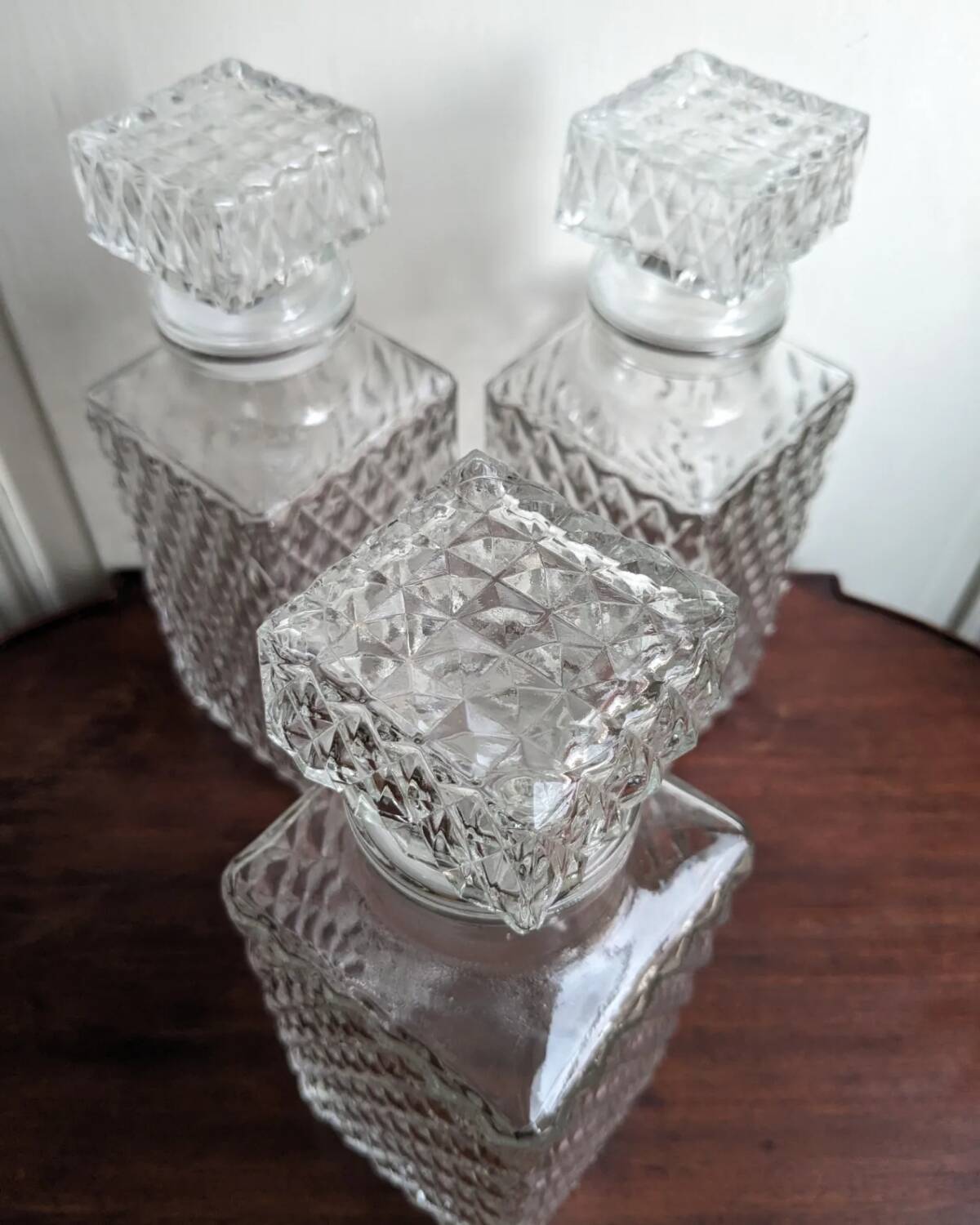 3 diamond-patterned chiseled glass carafes