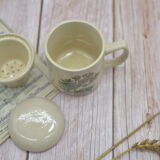 Vintage sandstone tisanière on the theme of chamomile botany