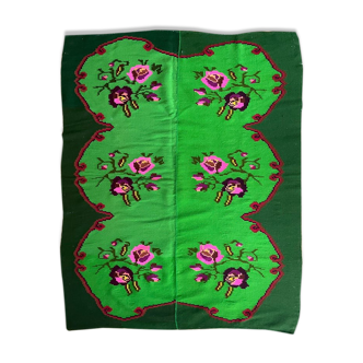 Charming vintage floral carpet on a green background handwoven in Romania, colorful flowers