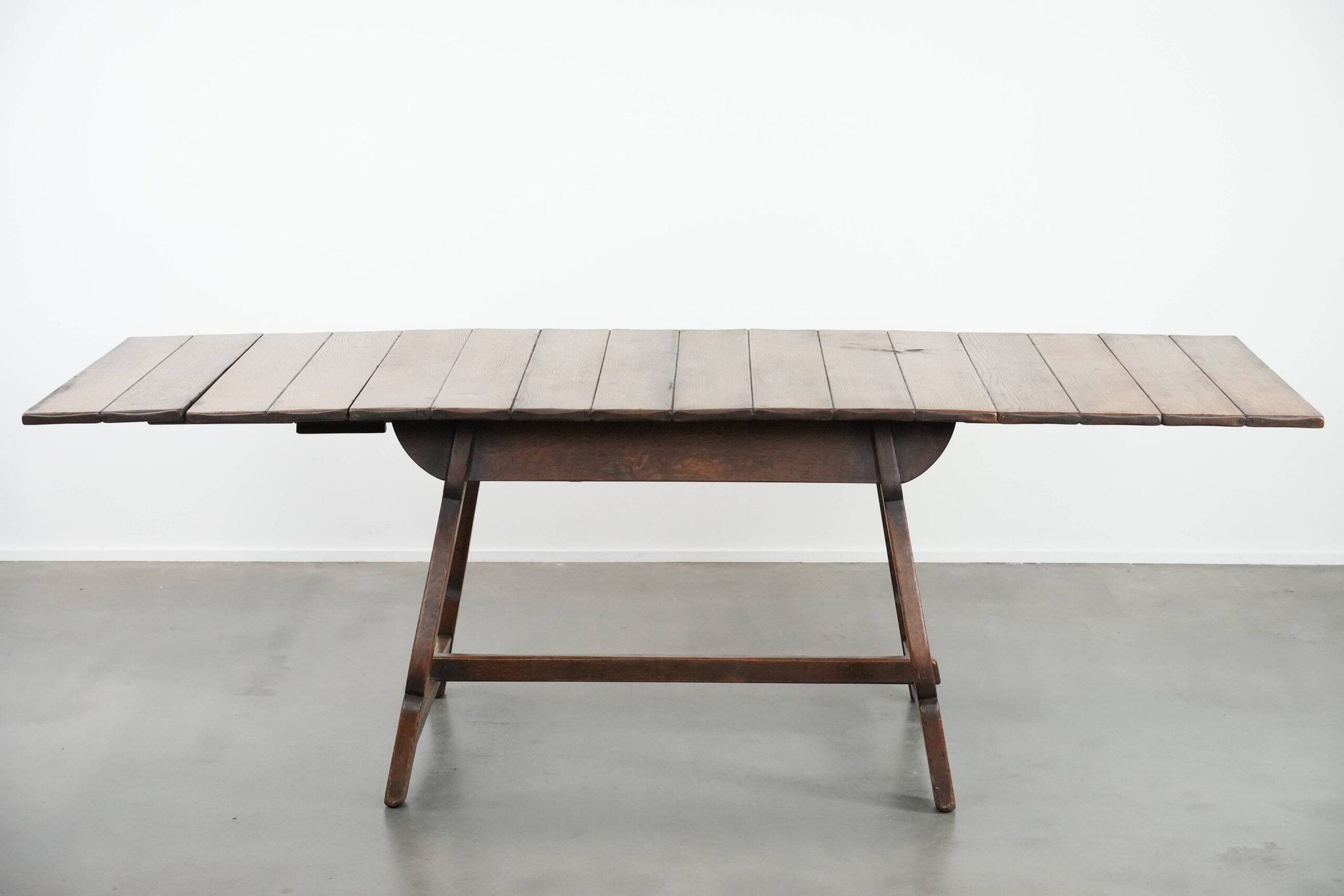 Antique Swiss extendable dining table made of oak from the mid-19th century