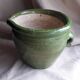 Glazed green terracotta pot.