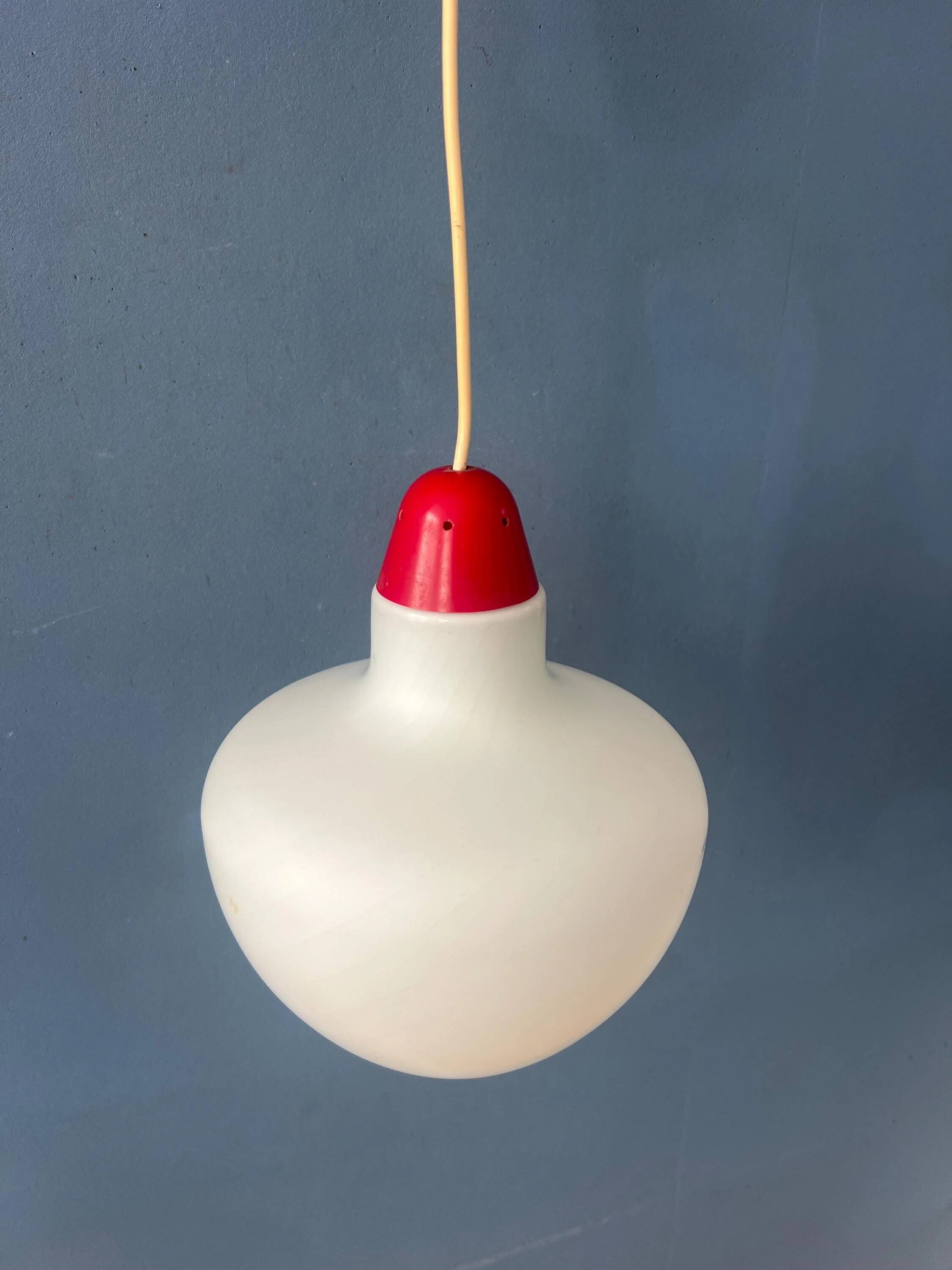Mid-Century opaline glass suspension with a red upper part and ceiling cover.