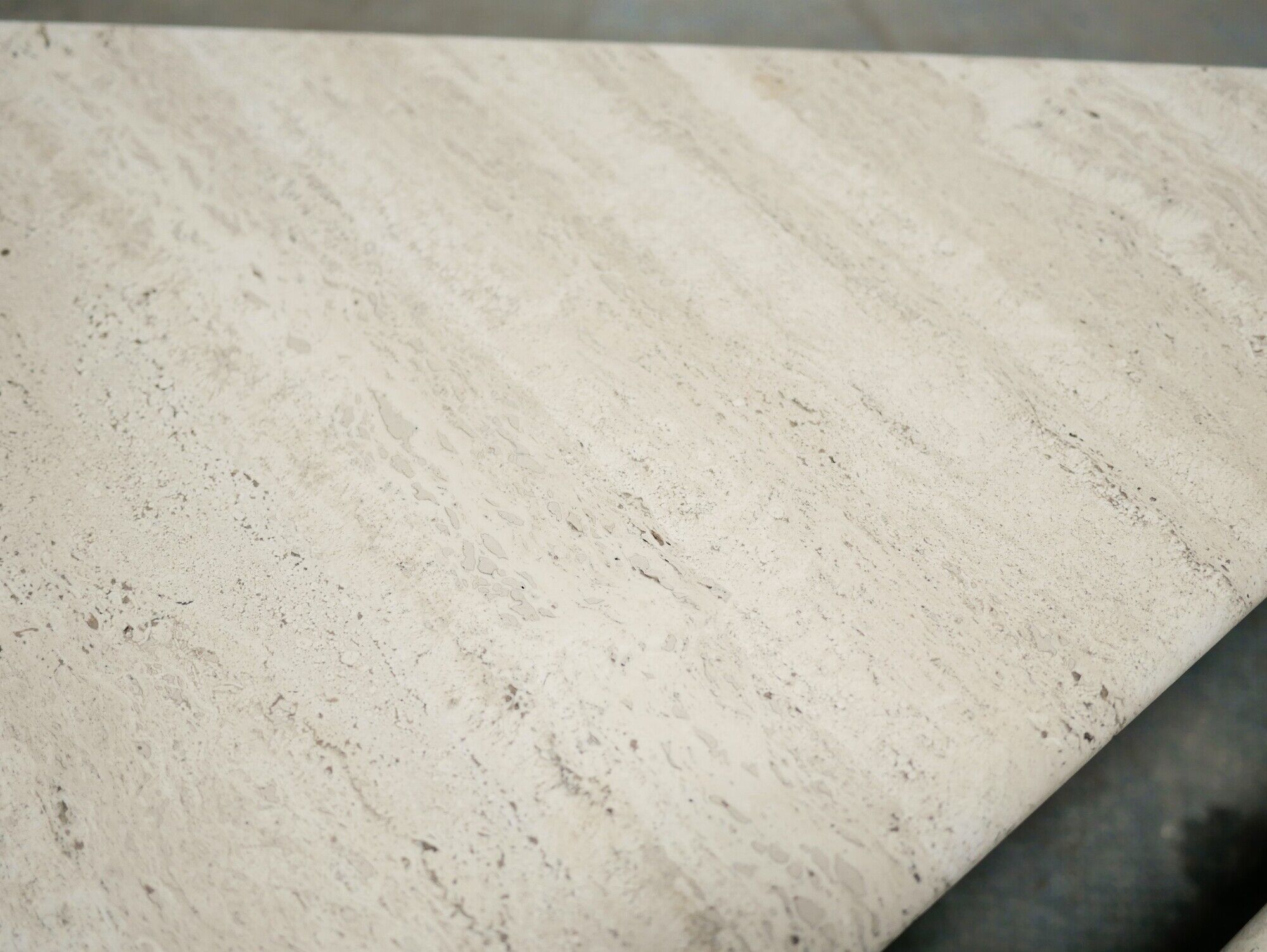 Series of 2 vintage travertine coffee tables published by Roche Bobois